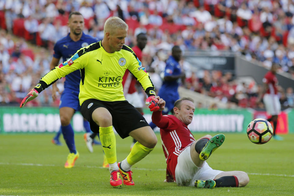 Football Soccer Britain - Leicester City v Manchester United - FA Community Shield - Wembley Stadium - 7/8/16 Manchester United's Wayne Rooney in action with Leicester City's Kasper Schmeichel Action Images via Reuters / Andrew Couldridge Livepic EDITORIAL USE ONLY. No use with unauthorized audio, video, data, fixture lists, club/league logos or "live" services. Online in-match use limited to 45 images, no video emulation. No use in betting, games or single club/league/player publications. Please contact your account representative for further details.