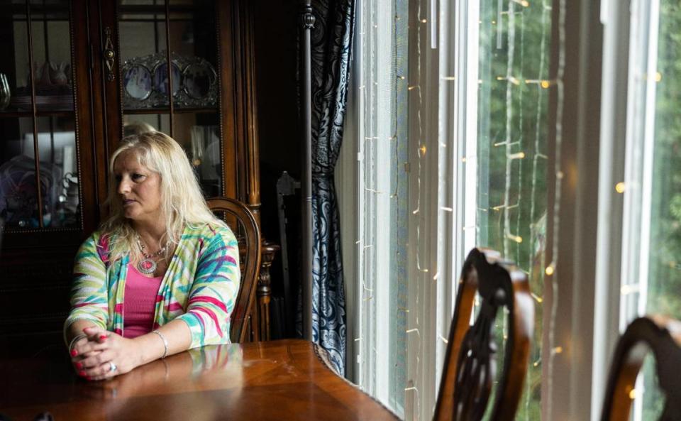 Lake Wylie resident Sherry Loeffler sits by the windows that have been the focus of a court battle. She says her HOA approved her plans for the windows, then reneged after she installed them - and hit her with nearly $12,000 in fines. “If I didn’t have the money to fight them, they would have taken my house,” she said.