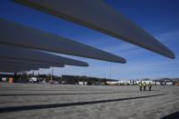 Wind turbine blades for South Fork Wind, an offshore wind farm, are stored at State Pier in New London, Conn., Monday, Dec. 4, 2023. (AP Photo/Seth Wenig)