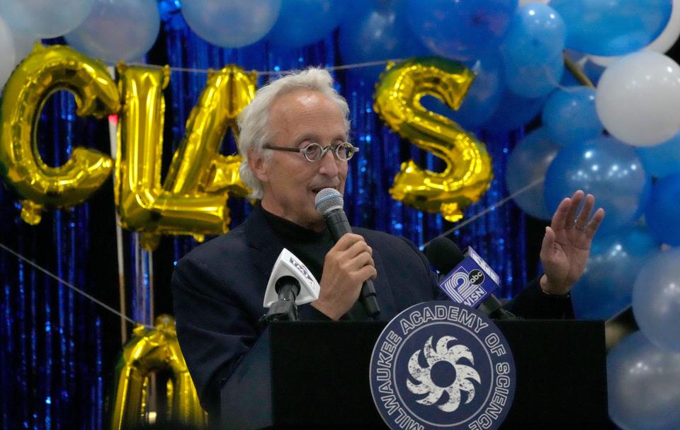 Barry Mandel, a national "I Have A Dream" Foundation board member, and Chief Executive Officer and Chairman of Mandel Group Inc., speaks during the K-5 promotion ceremony at the Milwaukee Academy of Science.