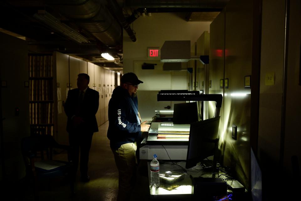 Kevin Yaw, who works for US Imaging, scans records in the archival rooms at the East Tennessee History Center in Knoxville. Knox County is creating searchable database for its deed books, some dating back to the late 1700s before Tennessee was a state.