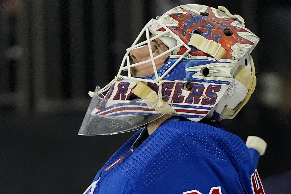 New York Rangers goaltender Igor Shesterkin (31) checks the scoreboard during the first period of Game 1 of the NHL hockey Eastern Conference Stanley Cup playoff finals against the Florida Panthers, Wednesday, May 22, 2024, in New York. (AP Photo/Julia Nikhinson)