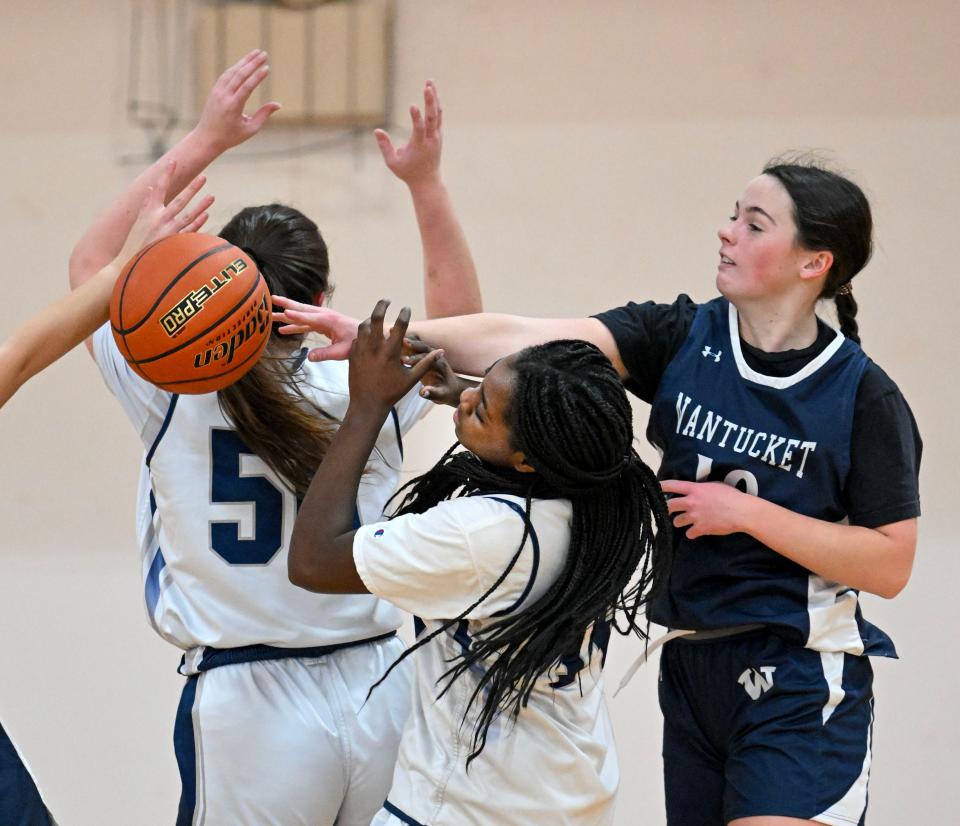 HYANNIS  02/02/24 Joan Harris of Nantucket and Noriann Wray of Sturgis East reach for a loose ball. Girls basketball
Ron Schloerb/Cape Cod Times