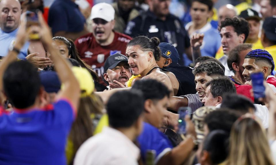 <span>Uruguay's Darwin Nuñez scuffles with fans after his team’s loss to Colombia at this summer’s Copa América.</span><span>Photograph: Brian Westerholt/EPA</span>