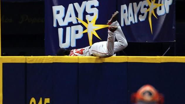 Benintendi goes over the wall. Source: MLB