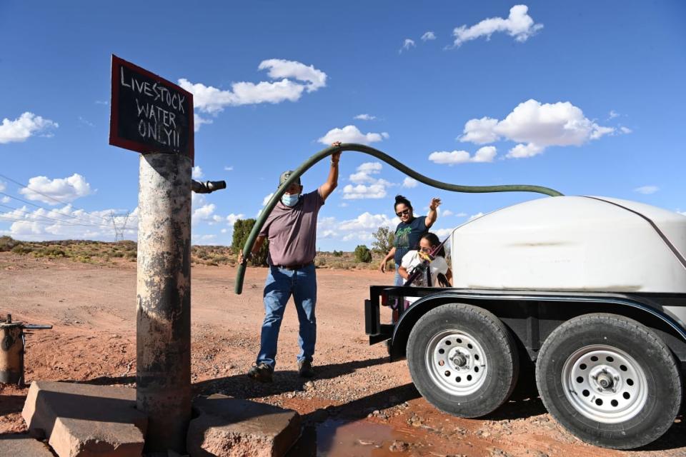 <div class="inline-image__title">1240701658</div> <div class="inline-image__caption"><p>Members of the Navajo Nation fill up a water tank at a watering station that is meant to provide water for livestock in Gap, AZ. Many people that live on Navajo Nation have water access issues despite their close proximity to the Colorado River. </p></div> <div class="inline-image__credit">Matt McClain/The Washington Post via Getty Images</div>