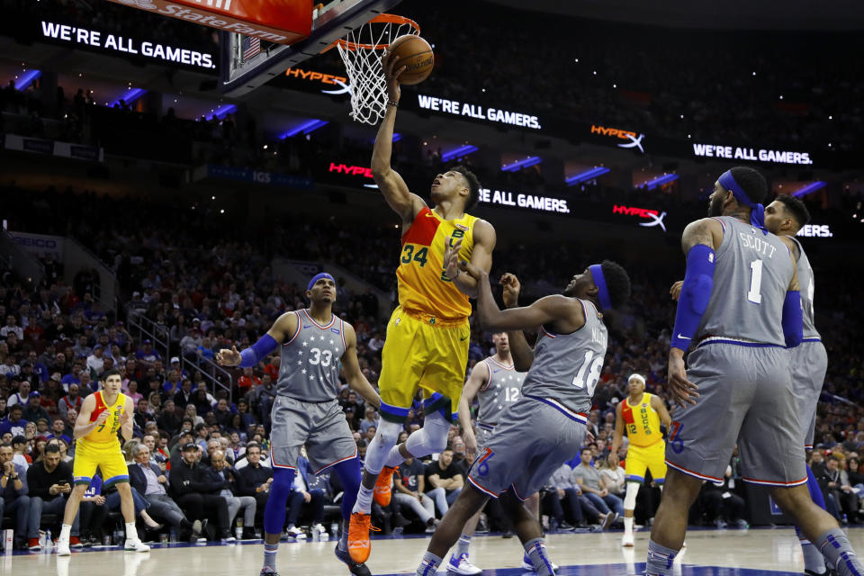 Milwaukee Bucks' Giannis Antetokounmpo (34) is fouled by Philadelphia 76ers' Shake Milton (18) during the second half of an NBA basketball game Thursday, April 4, 2019, in Philadelphia. Milwaukee won 128-122. (AP Photo/Matt Slocum)