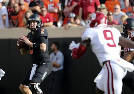 Nov 4, 2017; Stillwater, OK, USA; Oklahoma State Cowboys quarterback Mason Rudolph (2) throws during the first half against the Oklahoma Sooners at Boone Pickens Stadium. Mandatory Credit: Kevin Jairaj-USA TODAY Sports