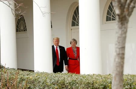 File photo: U.S. President Donald Trump escorts British Prime Minister Theresa May after their meeting at the White House in Washington, U.S., January 27, 2017. REUTERS/Kevin Lamarque