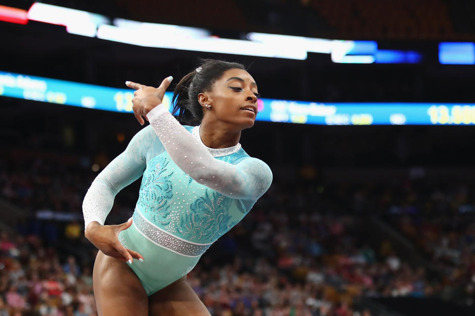 Simone Biles performs in a teal outfit during the floor exercise on Aug. 19. (Photo: Tim Bradbury via Getty Images)