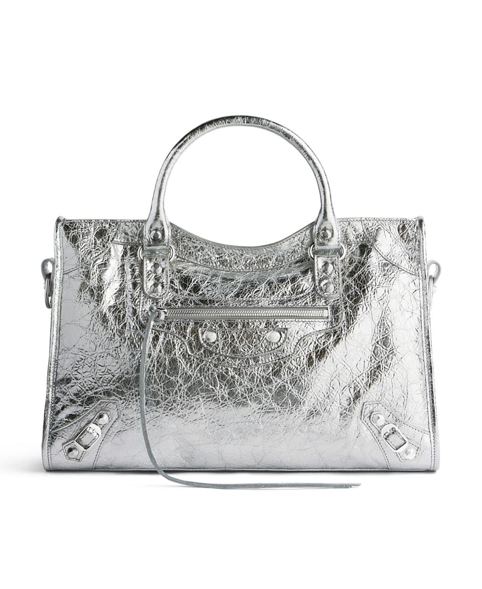 <p><a href="https://go.redirectingat.com?id=74968X1596630&url=https%3A%2F%2Fwww.saksfifthavenue.com%2Fproduct%2Fbalenciaga-le-city-medium-tote-bag-metallized-0400021182421.html&sref=https%3A%2F%2Fwww.harpersbazaar.com%2Ffashion%2Ftrends%2Fg60886461%2Fbest-trendy-bags-of-2024%2F" rel="nofollow noopener" target="_blank" data-ylk="slk:Shop Now;elm:context_link;itc:0;sec:content-canvas" class="link ">Shop Now</a></p><p>Le City Medium Bag</p><p>saksfifthavenue.com</p>