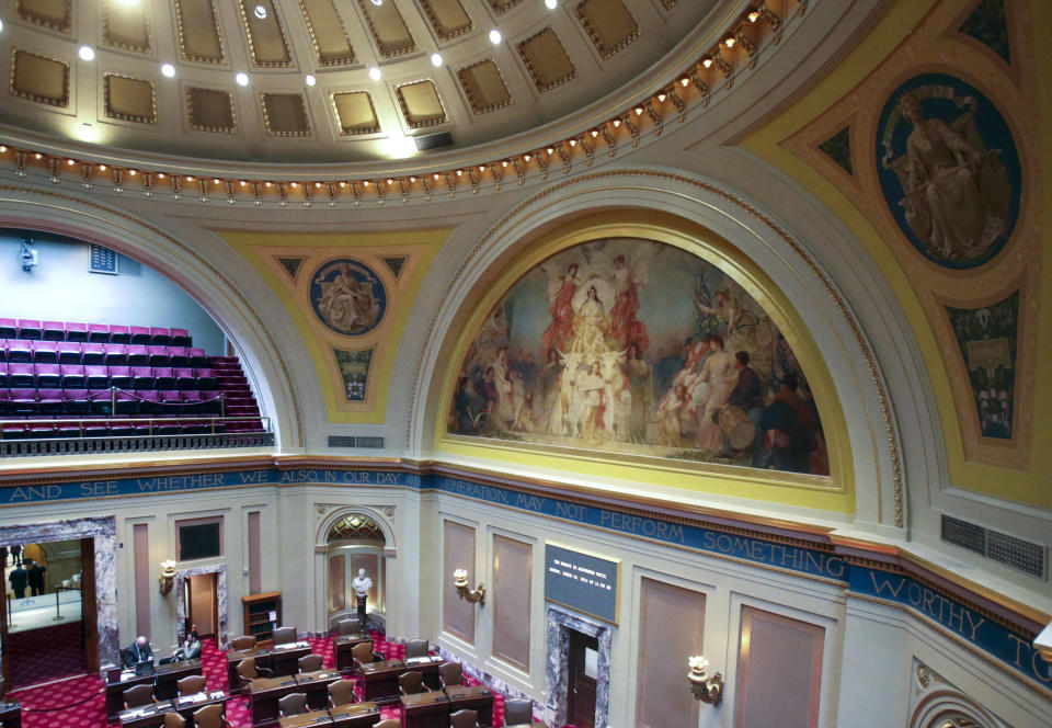In this March 6, 2014 photo, the mural "Granary of the World" adorns the walls of the Senate chamber at the Minnesota State Capitol in St. Paul, Minn. Beginning in the spring, work crews will take down paintings and sculpture and cover murals and statues as the renovation continues on the century old building. (AP Photo/Jim Mone)