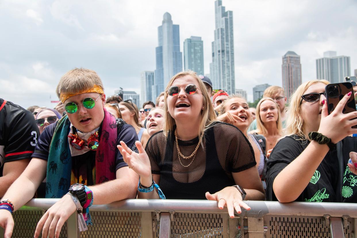 Thousands of concertgoers gather at Lollapalooza in Grant Park, Chicago (AP)