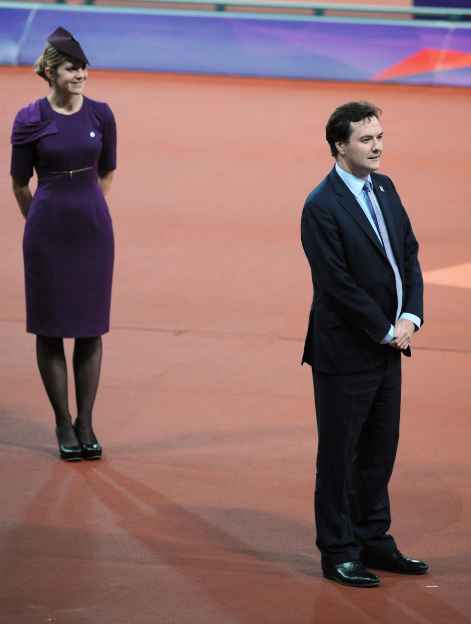 Britain;s Chancellor of the Exchequer George Osborne prepares to present medals for the men's T38 400m race, during which he was loudly booed as his name was announced in the Olympic Stadium, at the Paralympic Games in Stratford, London Monday Sept. 3, 2012. (AP Phto/Stefan Rousseau/PA) UNITED KINGDOM OUT