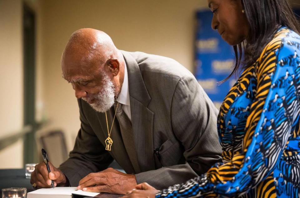 Olympic bronze medalist Dr. John Carlos autographs his book for Carolyn Veal-Hunter, for the second time after ten years, before being honored at the California Hawaii State Conference NAACP’s annual Legacy Hall of Fame Ceremony on Saturday, June 24, 2023, at the Sheraton Grand Sacramento Hotel downtown. Fellow Olympian and gold medalist Dr. Tommie Smith and 1967 Olympic Project for Human Rights co-organizers Dr. Kenneth Noel and Dr. Harry Edwards were also honored.