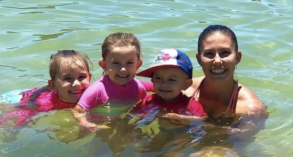 Hannah Clarke swimming with her three children.