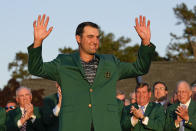 Scottie Scheffler celebrates after putting on the green jacket after winning the 86th Masters golf tournament on Sunday, April 10, 2022, in Augusta, Ga. (AP Photo/David J. Phillip)