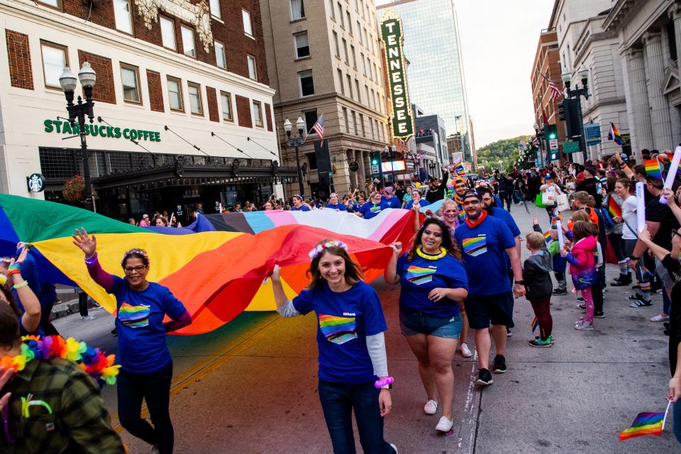 A giant Progress Pride Flag is carried down Gay Street during the Knox Pride Parade in downtown Knoxville on Friday, Sept. 30, 2022. Knox Pride will continues its annual Pride Fest activities at World's Fair Park through Sunday, Oct. 2, 2022.