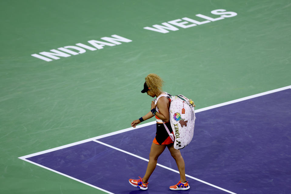 INDIAN WELLS, CALIFORNIA - MARCH 12: Naomi Osaka of Japan walks off the court after losing to Veronika Kudermetova of Russia during the BNP Paribas Open at the Indian Wells Tennis Garden on March 12, 2022 in Indian Wells, California. (Photo by Matthew Stockman/Getty Images)