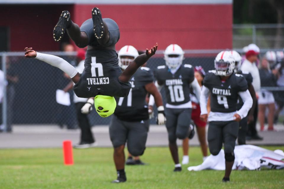 Palm Beach Central wide receiver Luby Maurice Jr (4) performs a backflip as the Broncos take the field prior to the start of the football game between Pahokee and host Palm Beach Central on Friday, September 16, 2022, in Wellington, FL. Final score, Pahokee, 34, Palm Beach Central, 14.