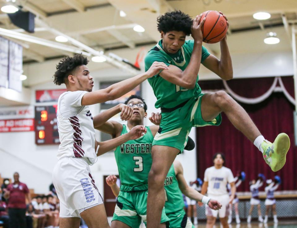 Western's Jayden Miles grabs a rebound at Tuesday night's LIT game at Jeffersontown High School. January 11, 2022