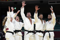 Members of Israel's team celebrate after defeating the Russian Olympic Committee team in their bronze medal match in team judo competition at the 2020 Summer Olympics, Saturday, July 31, 2021, in Tokyo, Japan. (AP Photo/Vincent Thian)