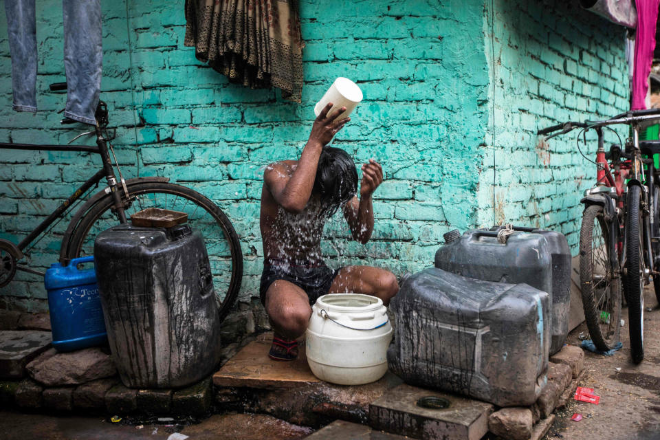 A boy cools off in New Delhi on May 3, 2022. (Xavier Galiana / AFP - Getty Images)