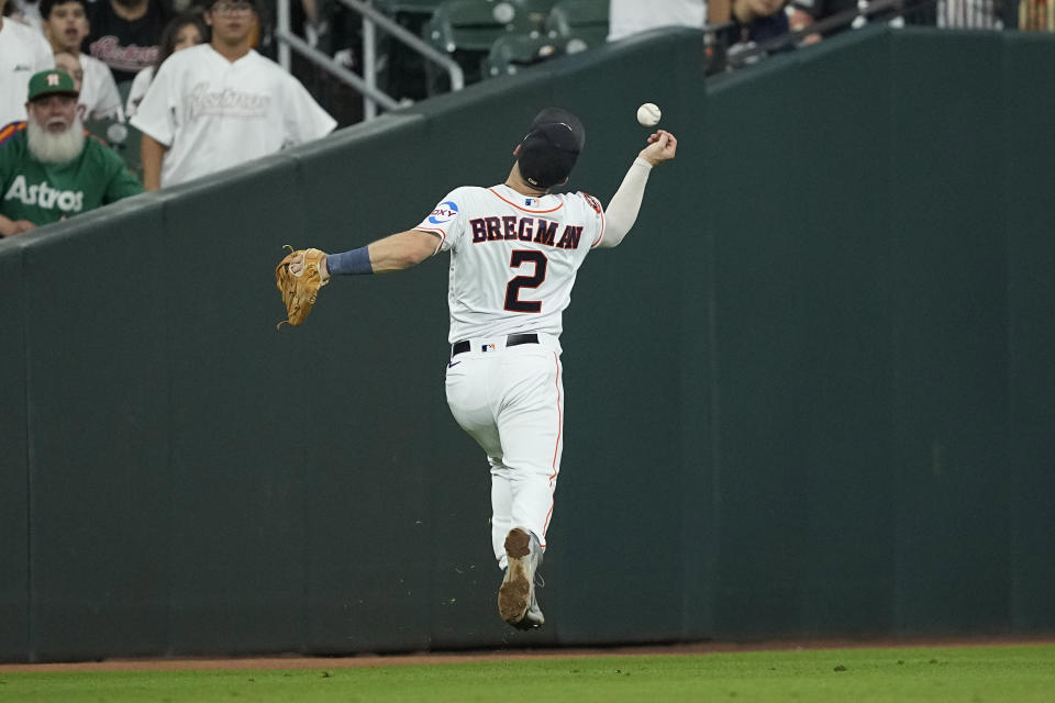 Houston Astros third baseman Alex Bregman tries to catch a double by Kansas City Royals' Michael Massey during the fourth inning of a baseball game Saturday, Sept. 23, 2023, in Houston. (AP Photo/David J. Phillip)