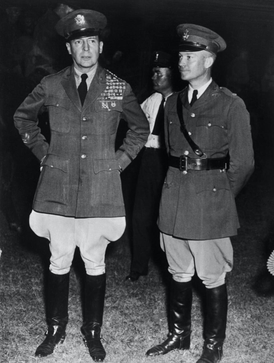 After his troops had ousted the Bonus Army, General Douglas MacArthur, left, stands with his second-in-command, Colonel Dwight D. Eisenhower. <a href="https://www.gettyimages.com/detail/news-photo/after-his-troops-had-ousted-the-bonus-army-from-its-news-photo/515553566?phrase=mcarthur%20bonus%20army&adppopup=true" rel="nofollow noopener" target="_blank" data-ylk="slk:Getty Images;elm:context_link;itc:0;sec:content-canvas" class="link ">Getty Images</a>