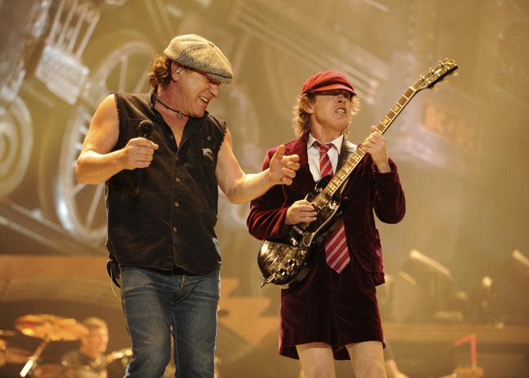 Malcolm Young (L), the rhythm guitarist who founded AC/DC with his brother Angus (R), was placed in a care facility late 2014 as he suffers dementia