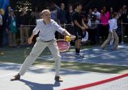 President Barack Obama plays tennis during the White House Easter Egg Roll on the tennis court on the South Lawn of the White House in Washington, Monday, April 6, 2015. Thousands of children gathered at the White House for the annual Easter Egg Roll. This year's event features live music, cooking stations, storytelling, and of course, some Easter egg roll. (AP Photo/Pablo Martinez Monsivais)