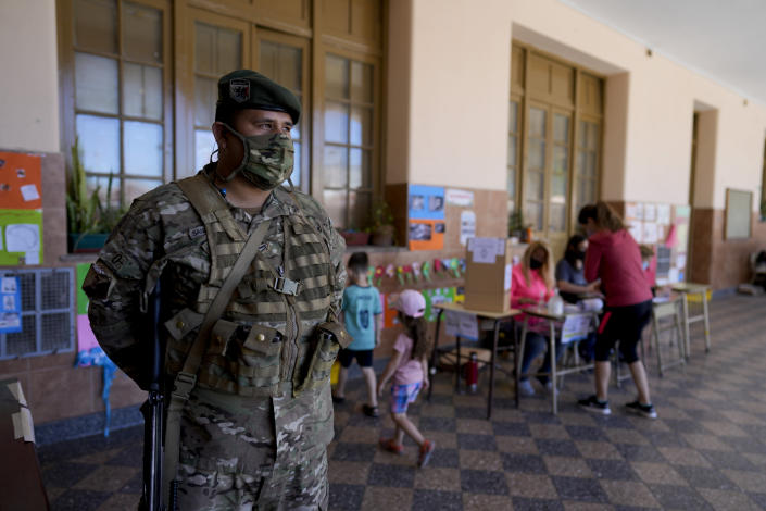 A soldier guards a polling station during midterm legislative elections in Buenos Aires, Argentina, Sunday, Nov. 14, 2021. (AP Photo/Natacha Pisarenko)