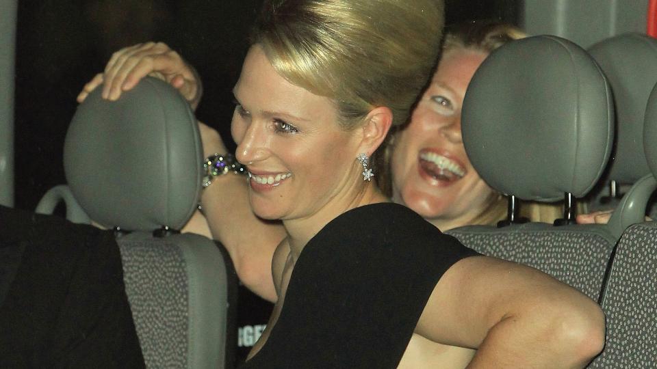 Zara Tindall in a car in a black dress with beehive hair