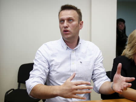 Russian opposition leader Alexei Navalny talks to the media before a hearing at the Lublinsky district court in Moscow, Russia, May 13, 2015. REUTERS/Maxim Zmeyev