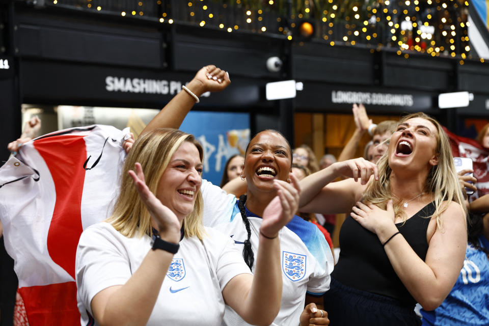 Soccer Football - FIFA Women's World Cup Australia and New Zealand 2023 - Fans in London gather for Australia v England - BOXPARK Wembley, London, Britain - August 16, 2023 England fans celebrate after Lauren Hemp scores their second goal Action Images via Reuters/Peter Cziborra