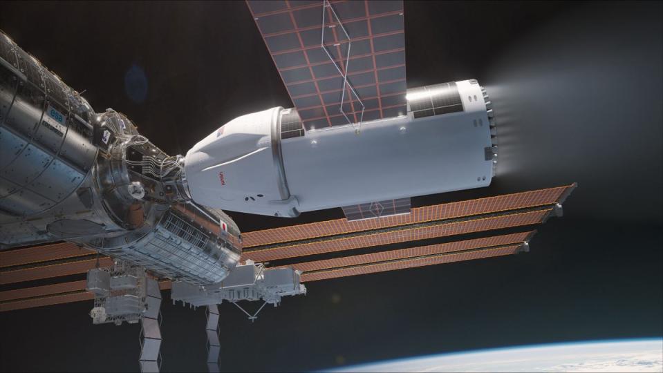     Artist's work depicting a cone-shaped spacecraft powered by solar panels firing its engines as it docked with the International Space Station. Behind it, the curve of the Earth and the blackness of space can be seen. 