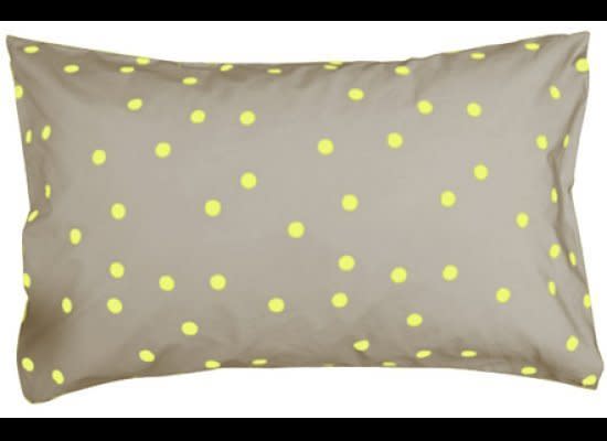 Fun yellow polka dots bring color to the bedroom, while the grey <a href="http://www.castleandthings.com.au/home.php?cat=275" target="_hplink">in this pillowcase</a> helps to tone down the neon.    