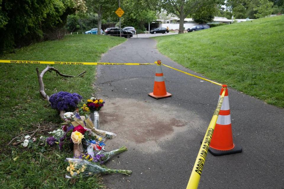 A memorial of flowers marks the location in Davis’ Sycamore Park on Monday, May 1, 2023, where Karim Abou Najm, a graduating senior at UC Davis, was stabbed to death Saturday. It was the second of three stabbings – two fatal – in the city in less than a week. 