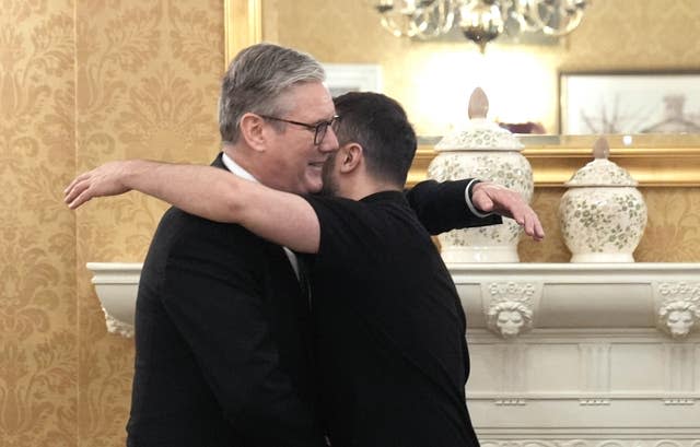 Sir Keir Starmer and Volodymyr Zelensky hugging each other