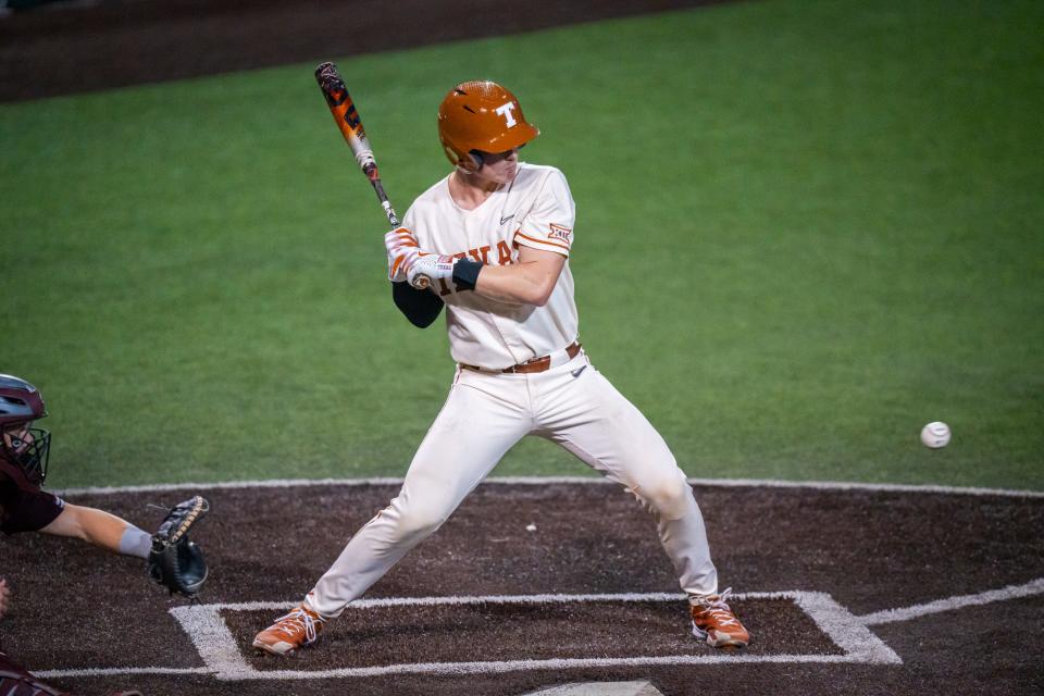 Texas' Kimble Schuessler lets the pitch pass while at bat in the first inning. He's one of four Longhorns who are hitting better than .400, and he had two hits in the 9-2 loss Tuesday night to Texas A&M. "We could take this in a really negative way, this tough stretch, but we’re going to take it in a positive outlook,” he said.