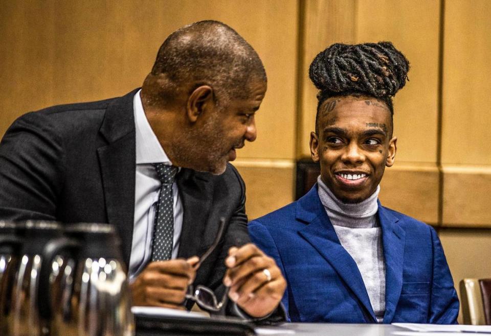 Defense lawyer David Howard (left) talks to his client Florida rapper Jamell Maurice Demons, known as YWN Melly, who is accused of killing two friends in October 2018, on Wednesday, April 12, 2023, in Fort Lauderdale.