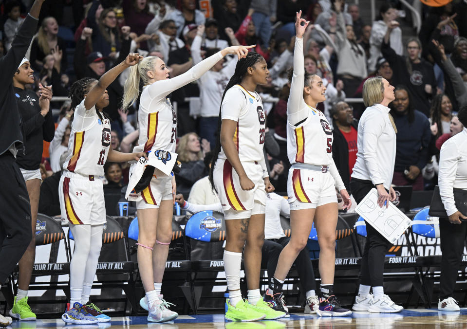 South Carolina guard MiLaysia Fulwiley (12), forward Chloe Kitts (21), forward Sania Feagin (20) and guard Tessa Johnson (5) react during the second half of a Sweet Sixteen round college basketball game during the NCAA Tournament, Friday, March 29, 2024, in Albany, N.Y. (AP Photo/Hans Pennink)