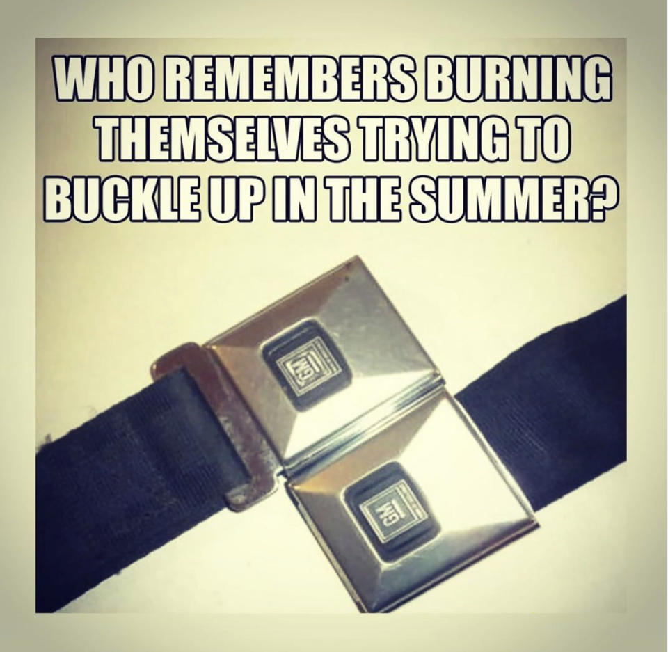 A vintage metal seatbelt buckle with overlaid text: "Who remembers burning themselves trying to buckle up in the summer?"