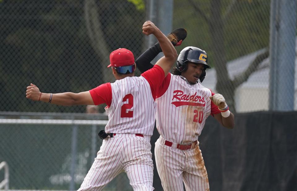 North Rockland's Jacob Herrera (20) and Jacob Fermin celebrate a run  during their 9-1 win over Suffern in baseball action at North Rockland High School on Thursday, April 27, 2023. 