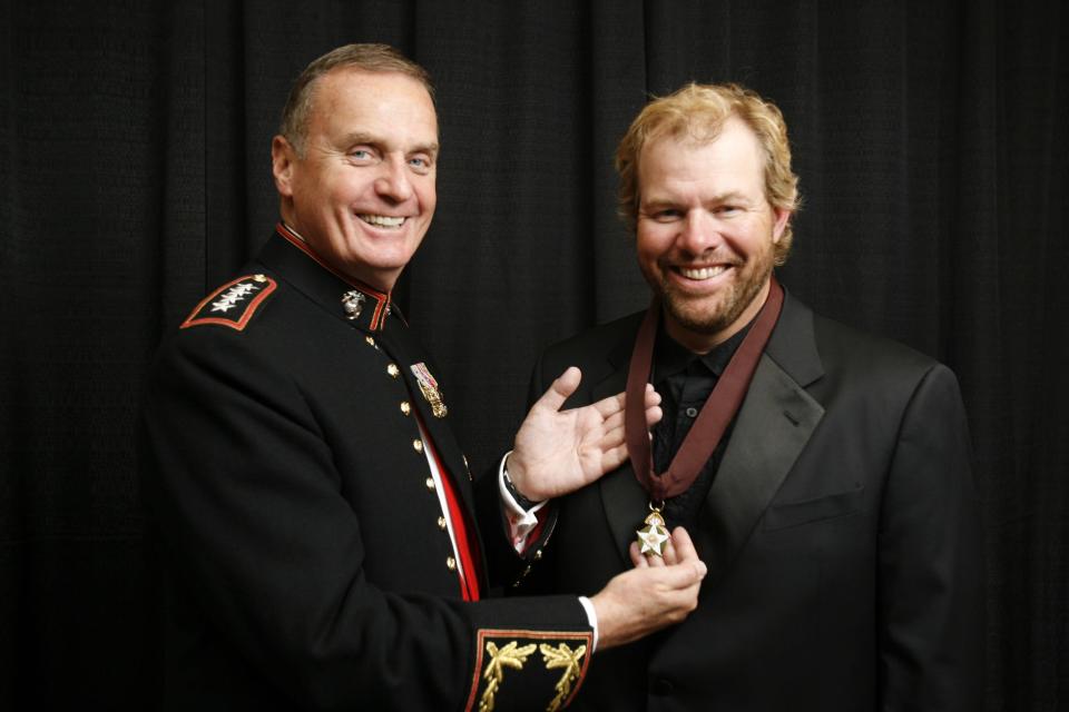 Retired Gen. James Jones, ex-commandant of the Marine Corps and NATO's former Supreme Allied Commander, Europe, poses for a photo with inductee Toby Keith during the 2007 Oklahoma Hall of Fame induction banquet at the Cox Convention Center onThursday, Nov. 8, 2007, in Oklahoma City, Okla. Keith picked Jones to introduce him for his Oklahoma Hall of Fame induction. 



Photo By Steve Sisney