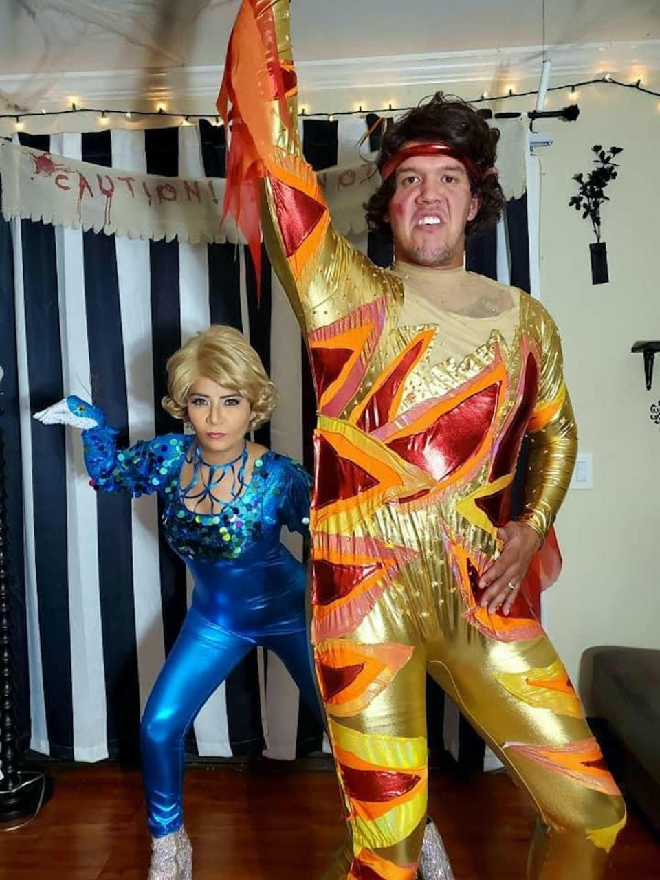 A couple dressed as Chazz Michael Michaels and Jimmy MacElroy pose for a photo.
