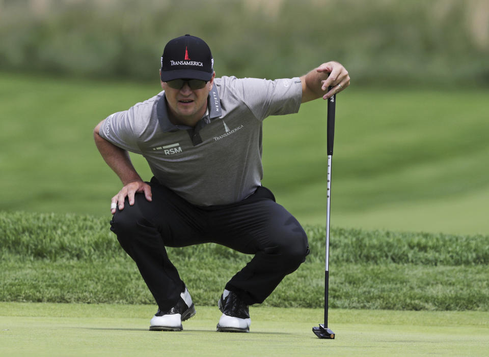 FILE - In this May 17, 2019, file photo, Zach Johnson lines up a putt on the 11th green during the second round of the PGA Championship golf tournament at Bethpage Black in Farmingdale, N.Y. Johnson is looking for his first victory since the 2015 British Open when he competes in A Military Tribute at The Greenbrier starting Thursday, Sept. 12, 2019, in White Sulphur Springs, W.Va. (AP Photo/Charles Krupa, File)