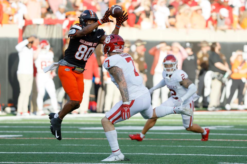 Oklahoma State Cowboys wide receiver Brennan Presley (80) catches a pass over Oklahoma Sooners linebacker Jaren Kanak (7) during a Bedlam college football game between the Oklahoma State University Cowboys (OSU) and the University of Oklahoma Sooners (OU) at Boone Pickens Stadium in Stillwater, Okla., Saturday, Nov. 4, 2023. Oklahoma State won 27-24.