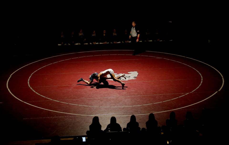 Edmond North and Edmond Memorial wrestlers compete during the 3 Dog Night wrestling dual between Edmond North, Edmond Santa Fe and Edmond Memorial at Edmond Memorial High School in Edmond, Okla., Tuesday, Jan. 11, 2022.