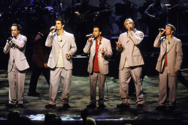 <p>Kevin Mazur/WireImage</p> Nick Carter (fourth from left) with the Backstreet Boys in 1999